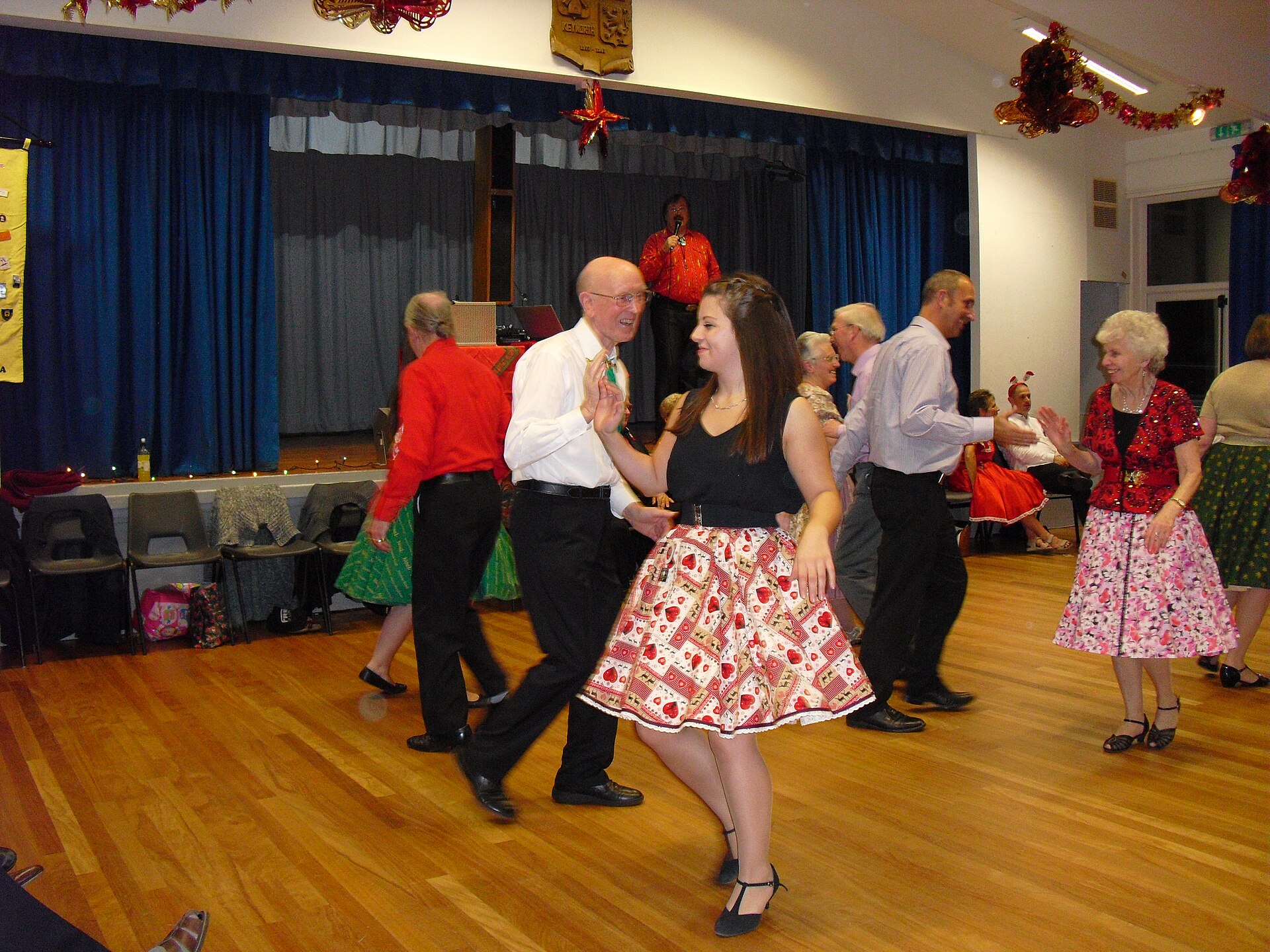 Square dancers moving through a lively friendship dance
